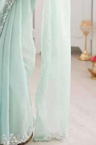 Sea green embellished sequinned  chiffon saree