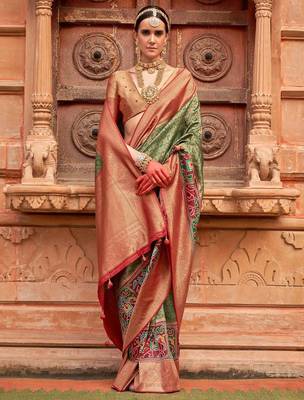 Green woven design printed zari  patola saree 1