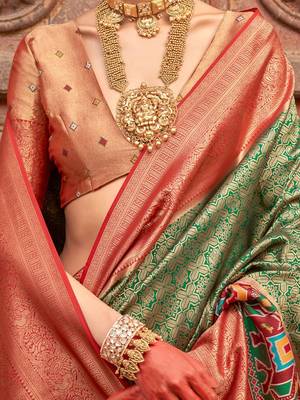 Green woven design printed zari  patola saree 3