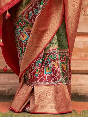 Green woven design printed zari  patola saree 5