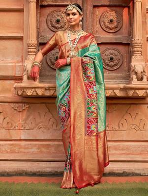 Green woven design zari patola saree 1
