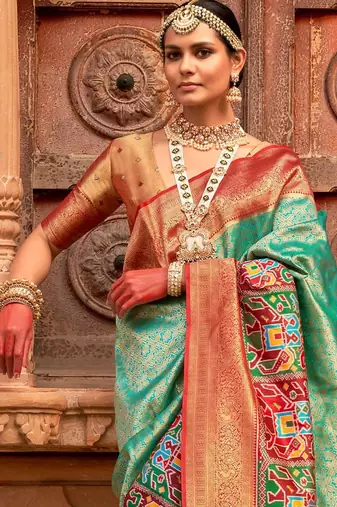 Green woven design zari patola saree