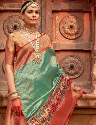 Green woven design zari patola saree 4