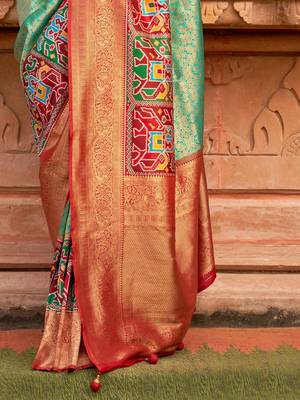 Green woven design zari patola saree 5