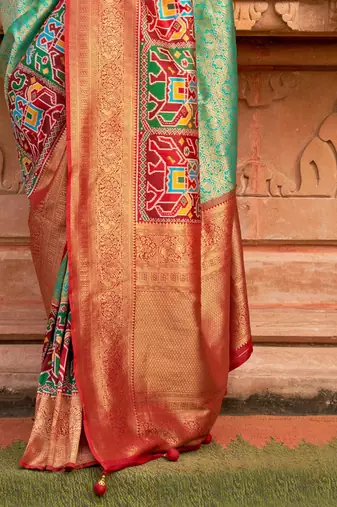 Green woven design zari patola saree
