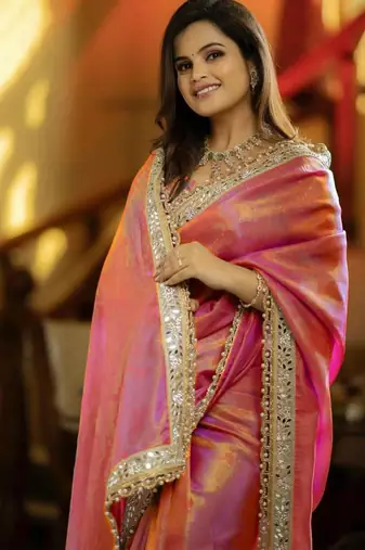 Pink solid embellished mirror work tissue celebrity saree