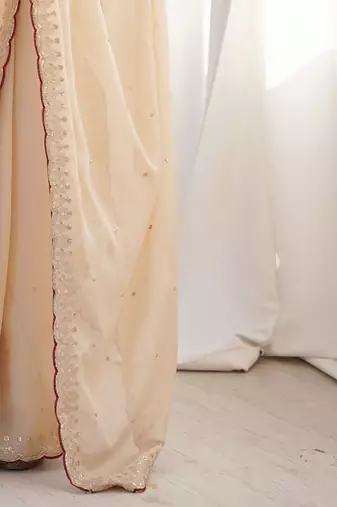 Cream embellished sequinned  georgette saree