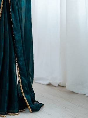 Teal teal embellished  chiffon sarees 5