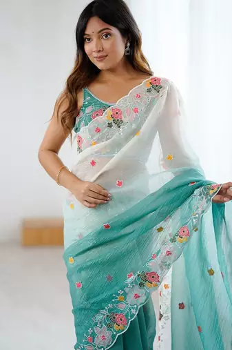 Teal ethnic motifs embroidered sequinned  chiffon saree with matching blouse