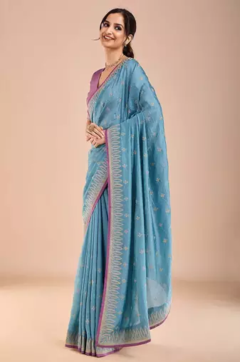 Blue ethnic motifs beads and stones saree