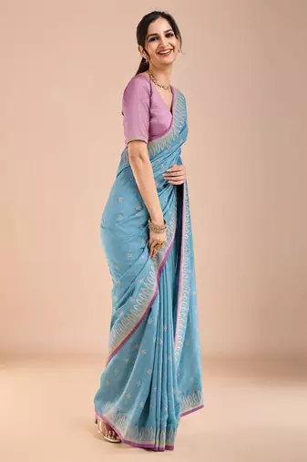 Blue ethnic motifs beads and stones saree