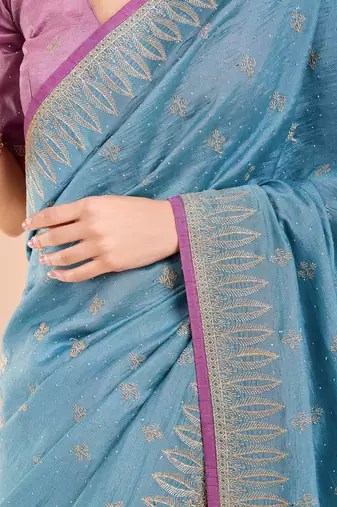 Blue ethnic motifs beads and stones saree