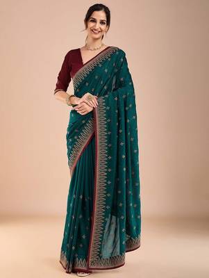 Teal ethnic motifs embroidered beads and stones saree 1
