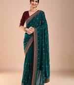 Teal ethnic motifs embroidered beads and stones saree