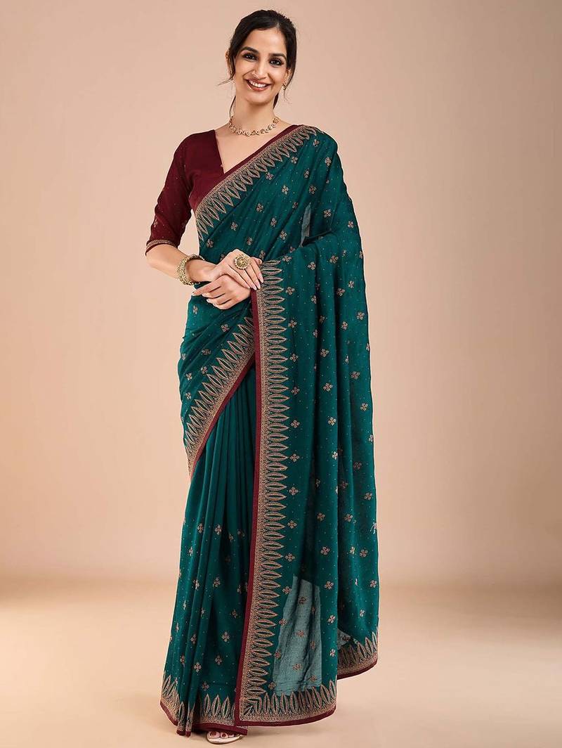 Teal ethnic motifs embroidered beads and stones saree