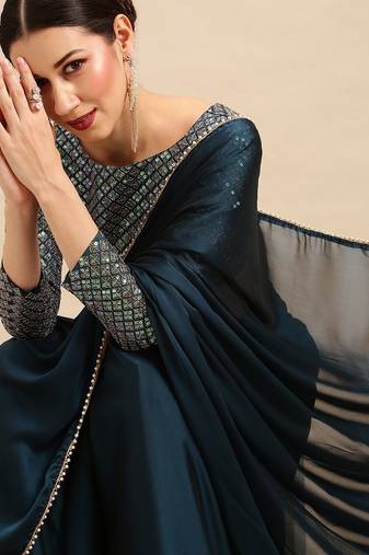 Teal sequinned  georgette saree