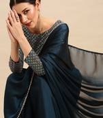 Teal sequinned  georgette saree