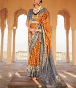 Mustard mustard & grey ethnic woven design zari patola saree