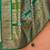 Red red & green ethnic motifs woven design zari saree