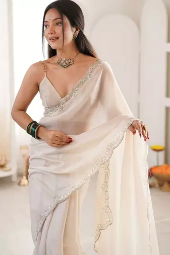 Off white embellished sequinned satin heavy work saree