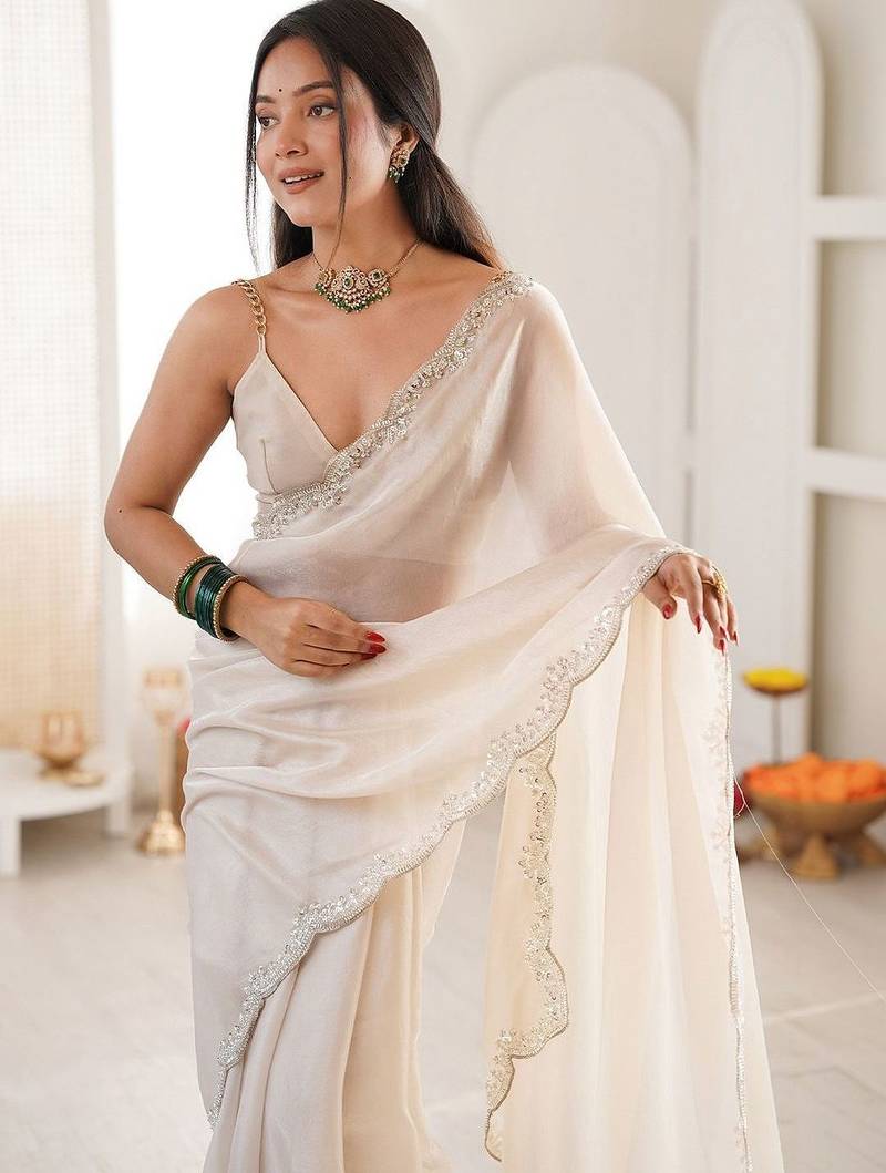 Off white embellished sequinned satin heavy work saree