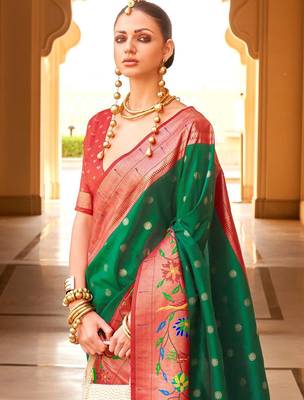 Green woven design zari silk blend designer banarasi saree 4