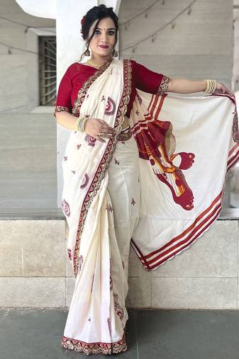 Off white ethnic motifs beads and stones block print saree