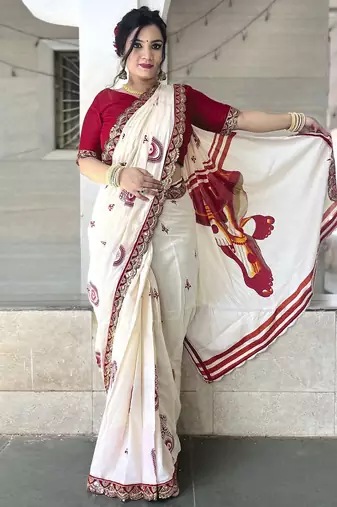 Off white ethnic motifs beads and stones block print saree