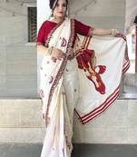 Off white ethnic motifs beads and stones block print saree