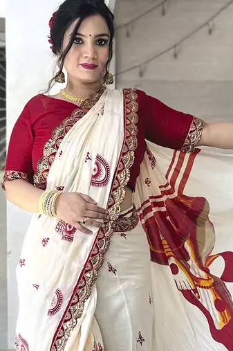 Off white ethnic motifs beads and stones block print saree