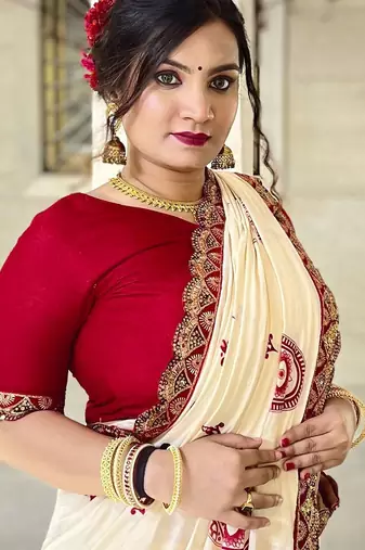 Off white ethnic motifs beads and stones block print saree