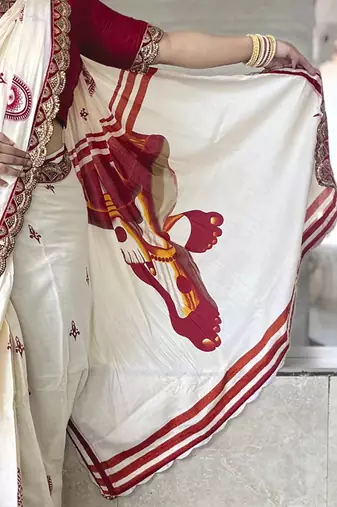 Off white ethnic motifs beads and stones block print saree