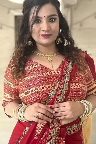 Red ethnic motifs beads and stones block print saree