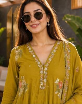 women mustard chanderi embroidered a-line kurta with trouser & dupatta 2