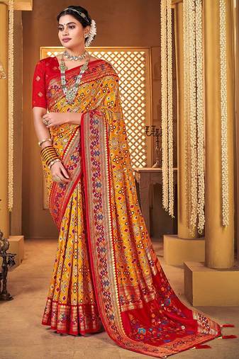 Mustard ethnic motifs printed zari patola saree