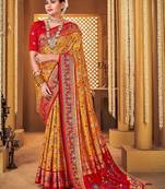 Mustard ethnic motifs printed zari patola saree