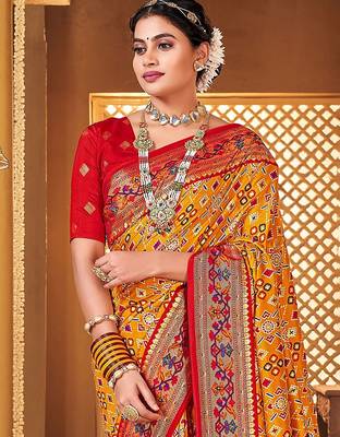 Mustard ethnic motifs printed zari patola saree 4