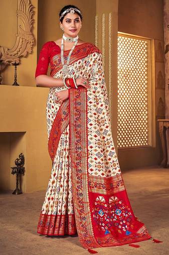 Off white ethnic motifs woven design zari patola saree