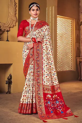 Off white ethnic motifs woven design zari patola saree