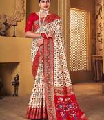 Off white ethnic motifs woven design zari patola saree