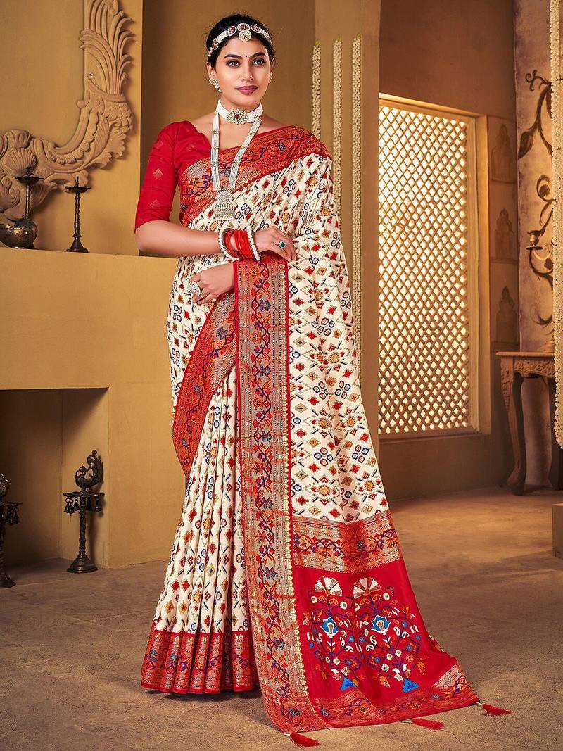 Off white ethnic motifs woven design zari patola saree