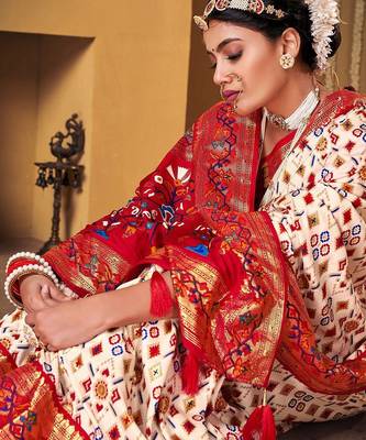 Off white ethnic motifs woven design zari patola saree 2