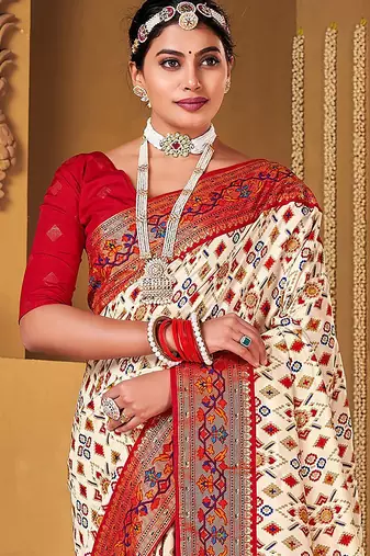 Off white ethnic motifs woven design zari patola saree