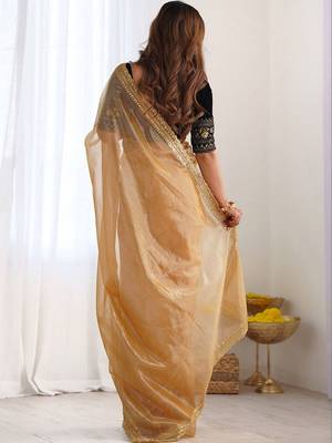 Gold sequinned net designer saree 5