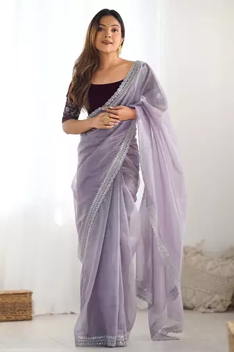 Purple sequinned net saree