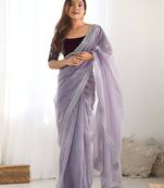 Purple sequinned net saree