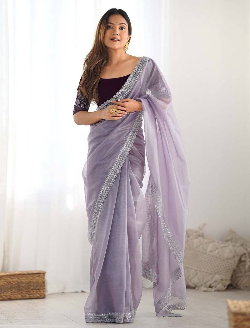 Purple sequinned net saree