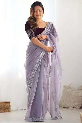 Purple sequinned net saree