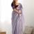 Purple sequinned net saree