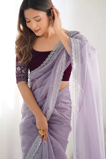 Purple sequinned net saree